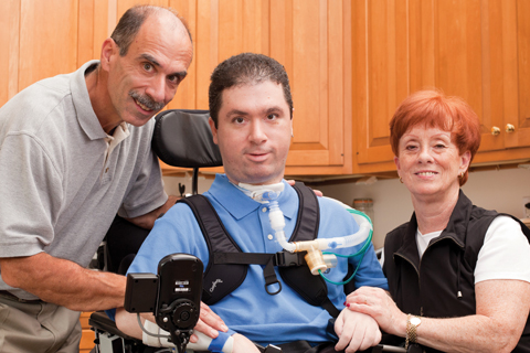 Adam and his parents photo